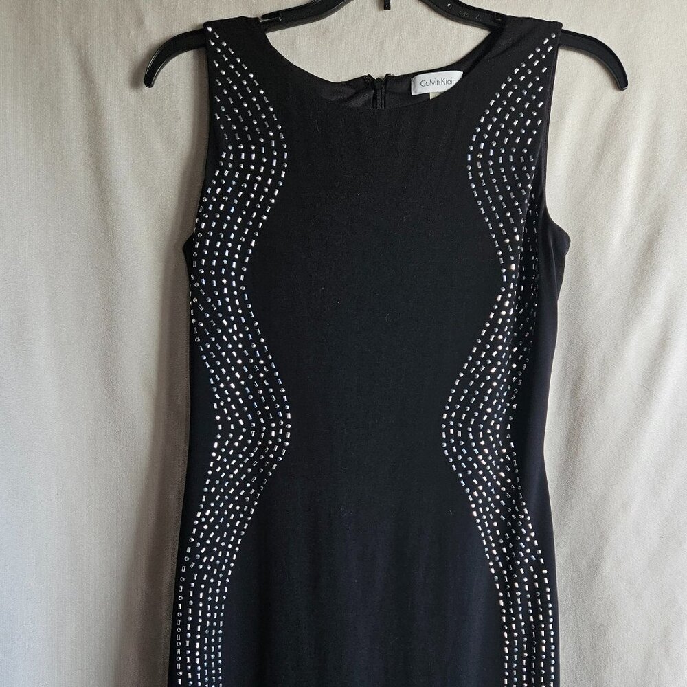 Calvin Klein size 4 dress, black with silver embellishments on the side.